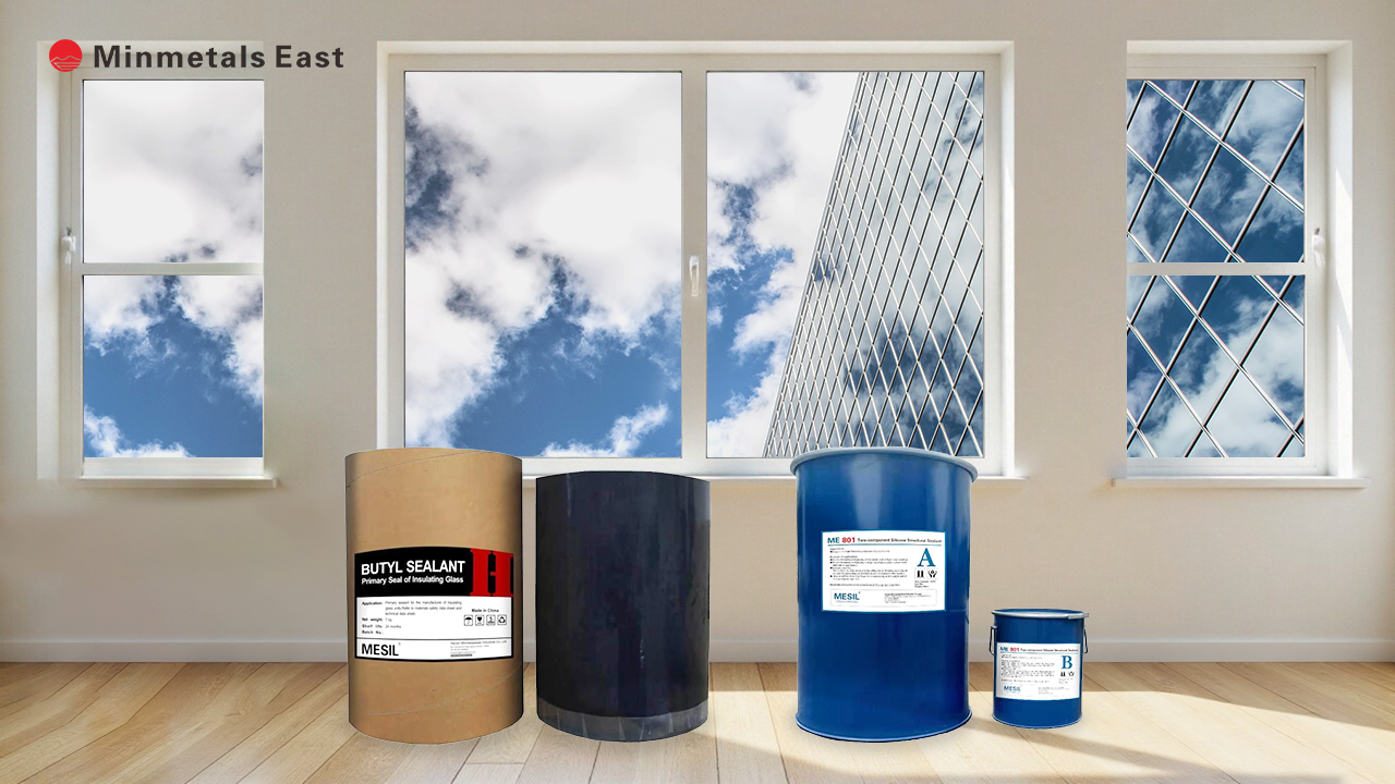 A room with four different-sized sealant containers; blue sky, clouds, and a modern building reflected in the windows.