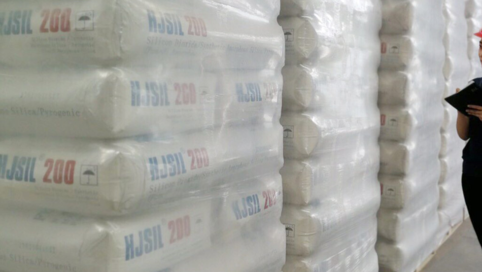 Stacks of HJSIL® 200 Hydrophilic Fumed Silica bags in a warehouse.
