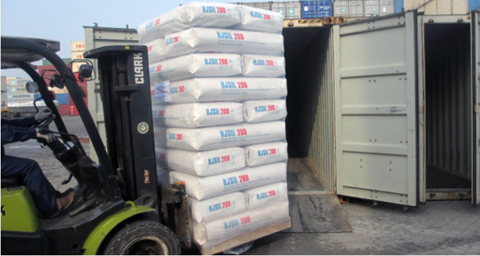 Forklift loading bags of HJSIL® 200 Hydrophilic Fumed Silica into a container.