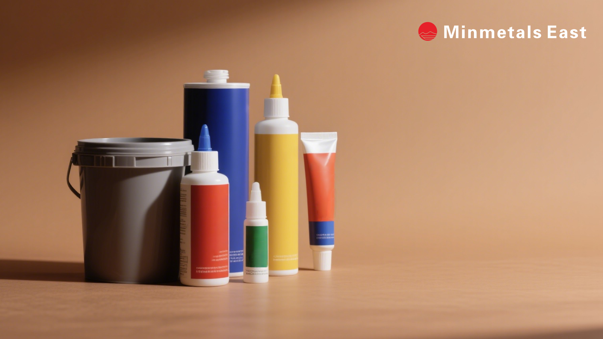 Various containers of adhesives and sealants, representing raw materials and finished products, by Minmetals East. Ideal for industrial bonding solutions.